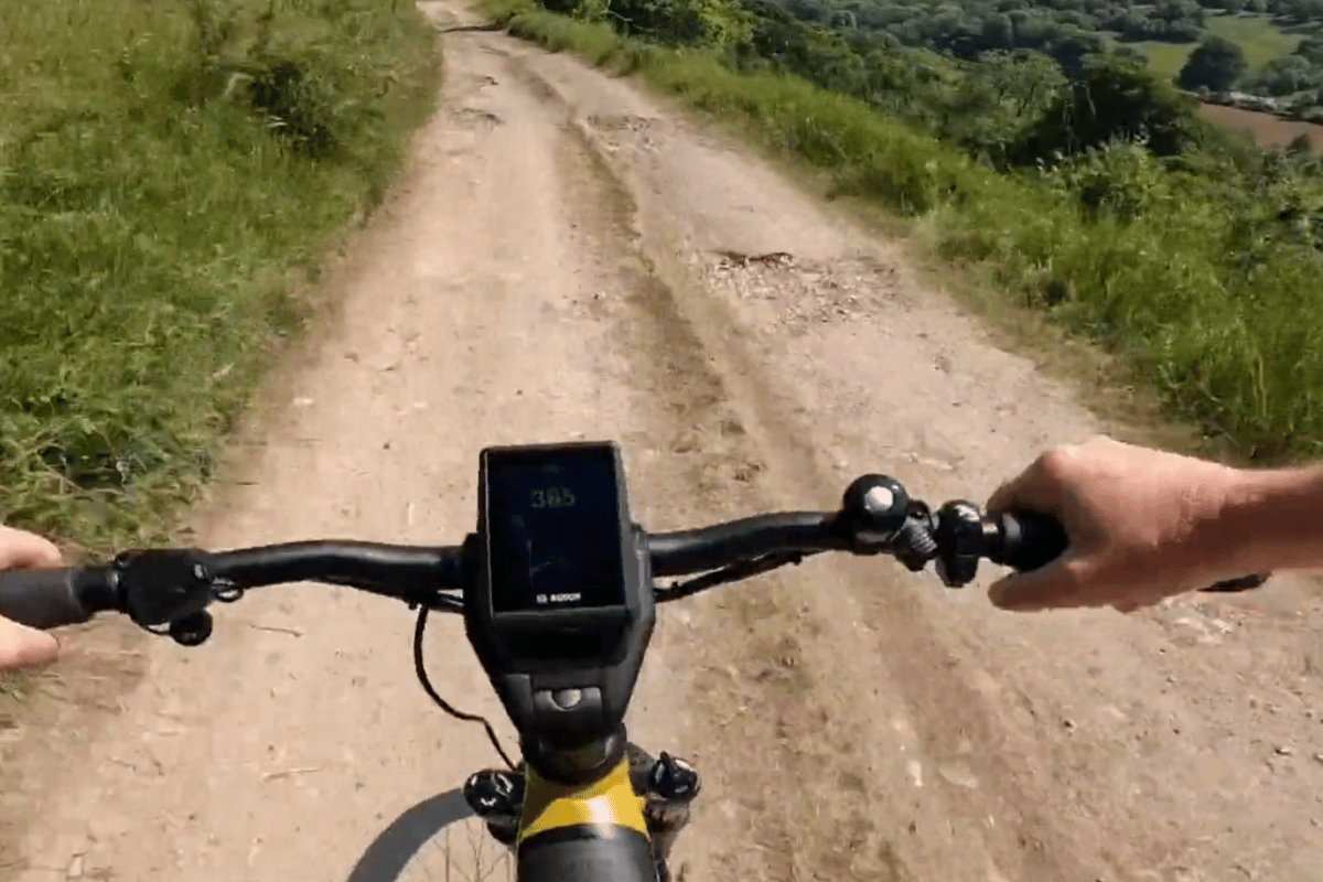 E-bike display showing range information on trail