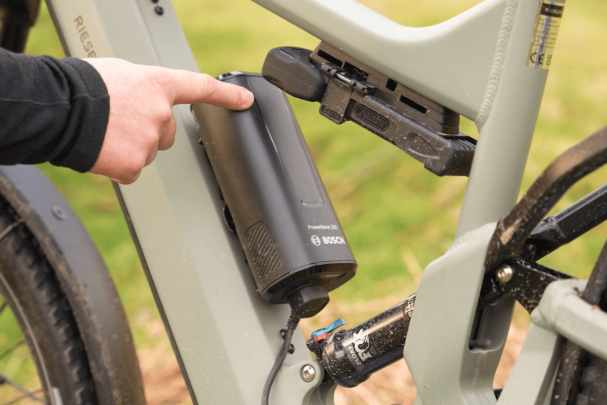 Bosch PowerMore battery being removed from e-bike frame