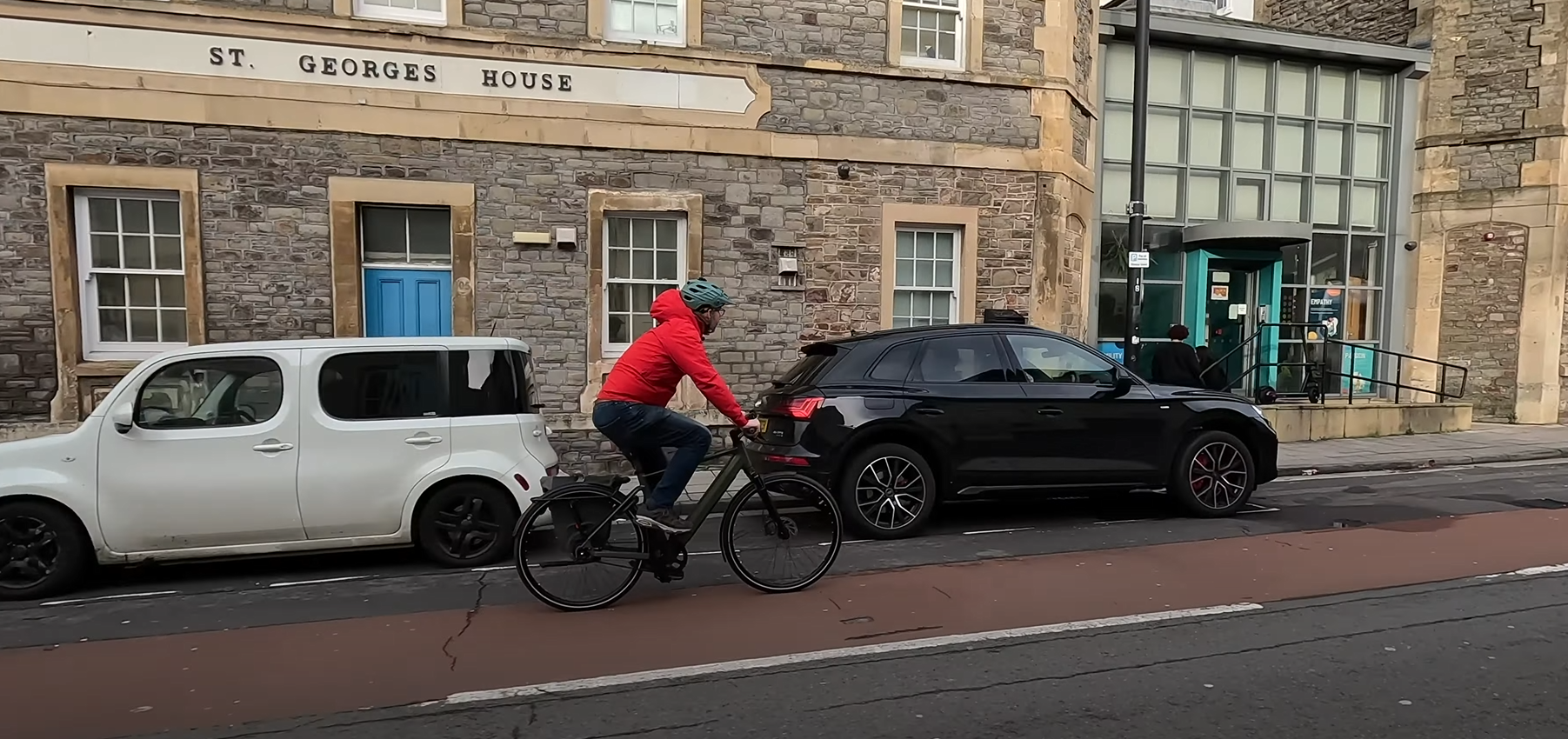 E-bike rider commuting through an urban street