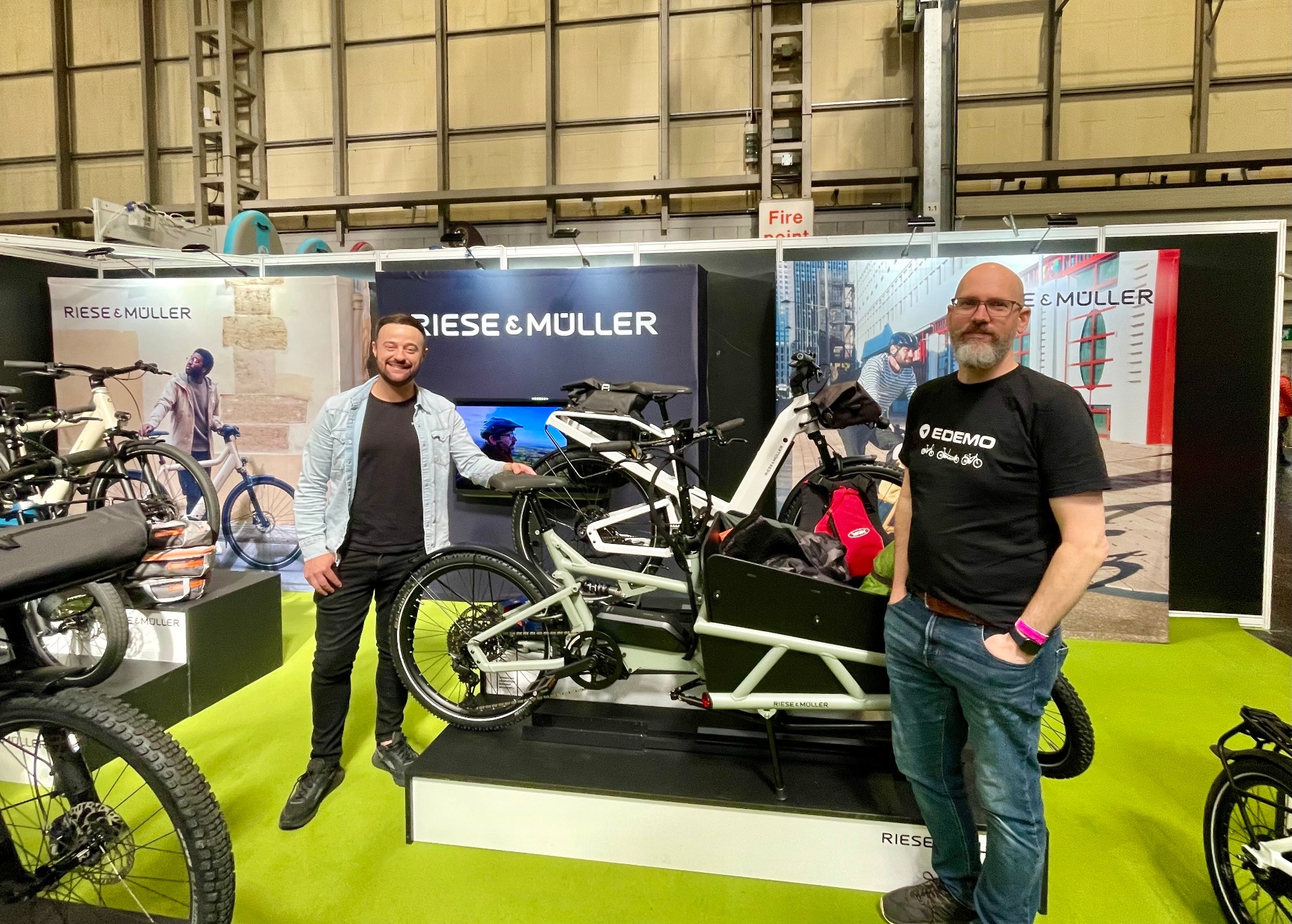 Dan at a Riese & Müller stand at a bike show