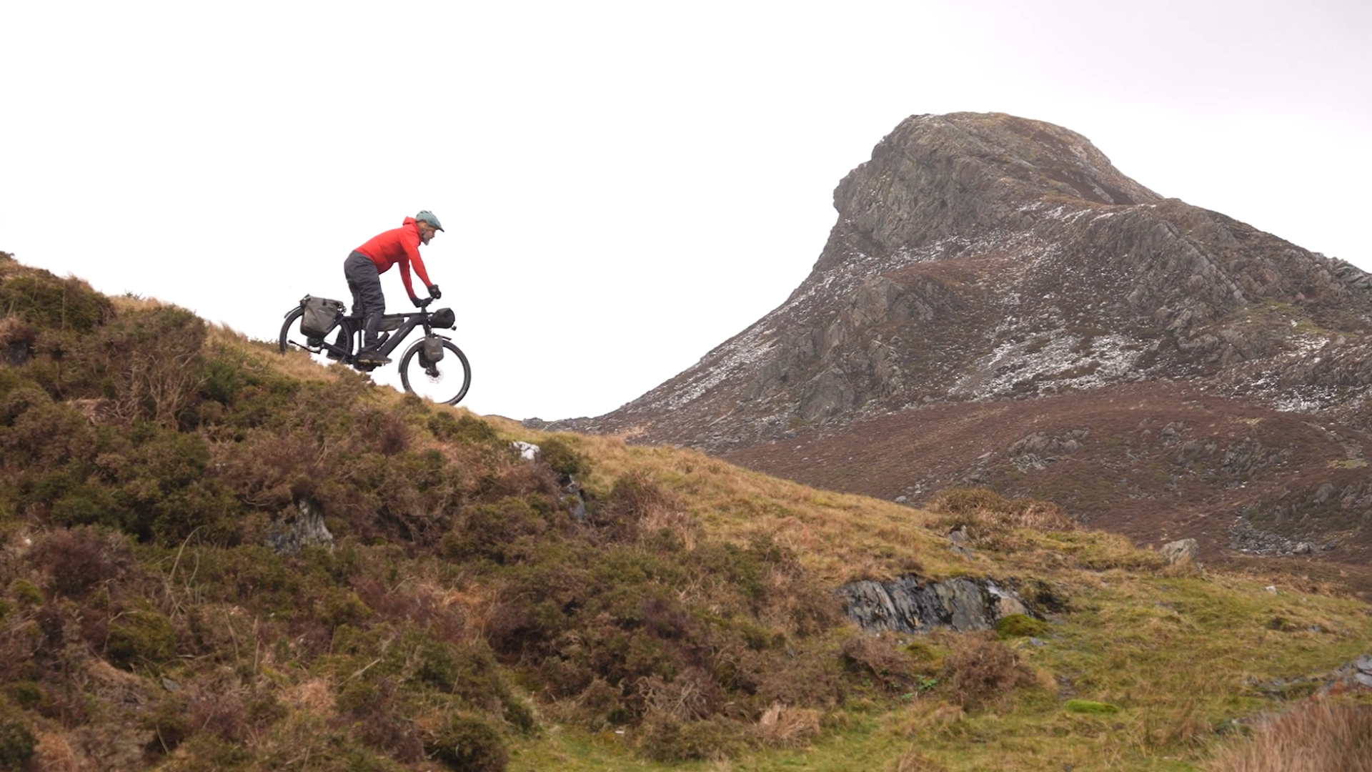 Rider on a mountain trail with panoramic views